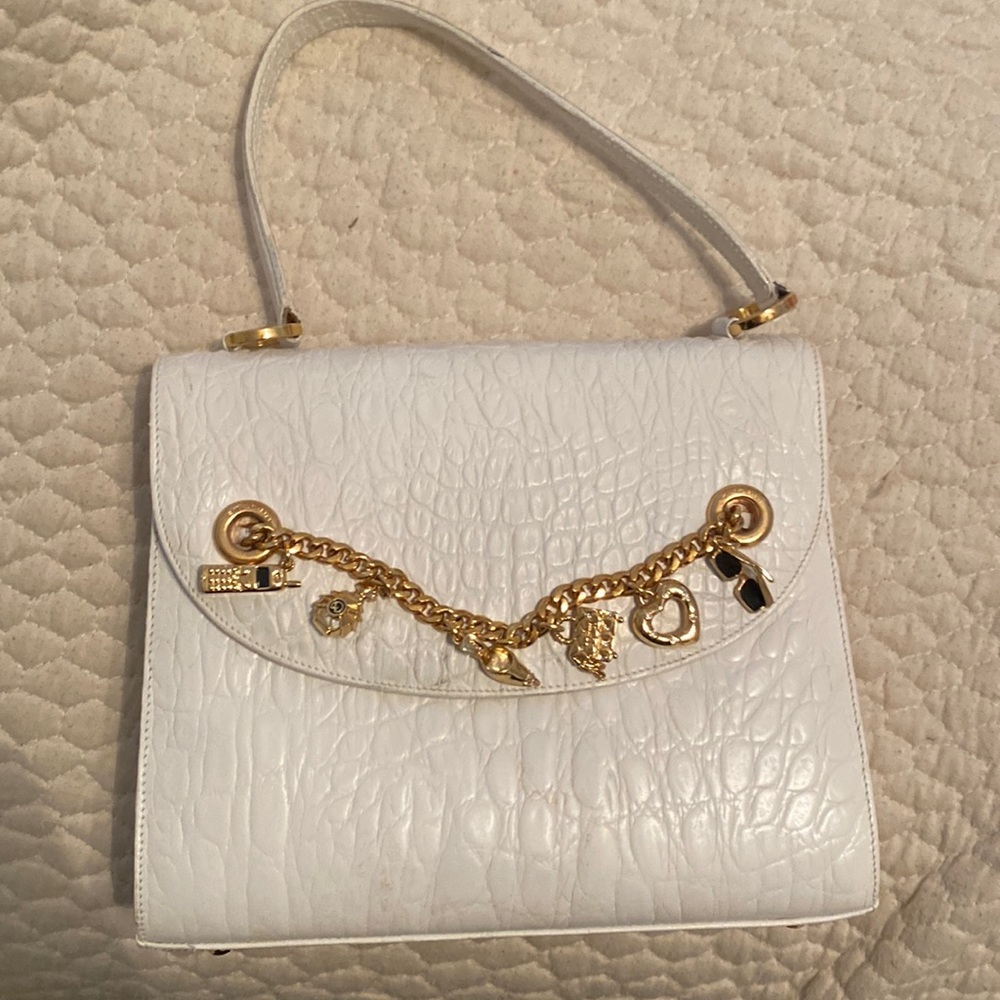 St. John vintage white snakeskin purse. Fun gold charm. Like new